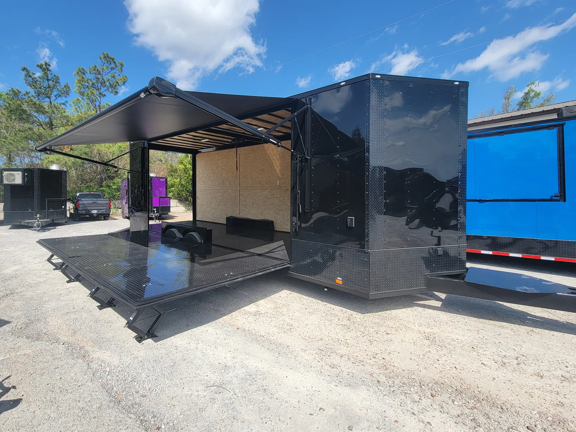 644-8.5-x-24-black-with-blackout-custom-stage-trailer-3.webp 8.5' X 24' Black With Blackout Custom Stage Trailer