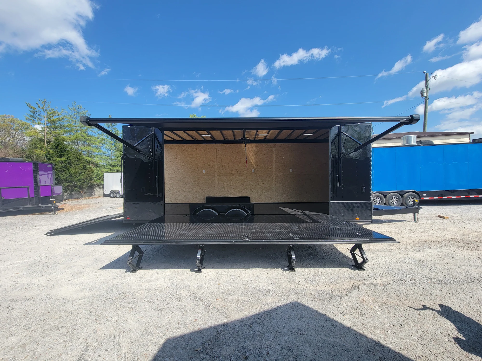 644-8.5-x-24-black-with-blackout-custom-stage-trailer-4.webp 8.5' X 24' Black With Blackout Custom Stage Trailer