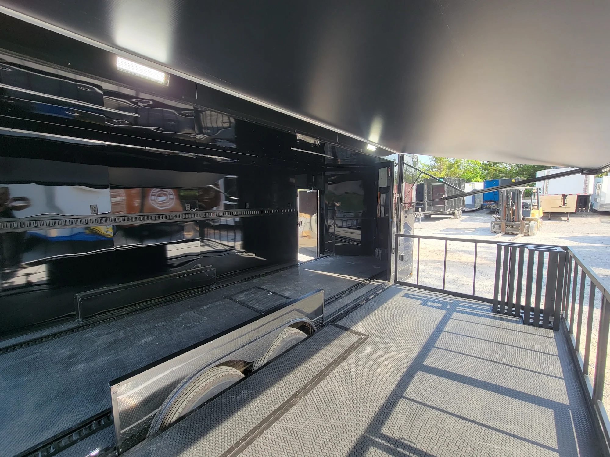 645-8.5-x-24-black-with-blackout-stage-trailer-with-awning-semi-screwless-exterior-16.webp 8.5' X 24' Black With Blackout Stage Trailer With Awning Semi Screwless Exterior