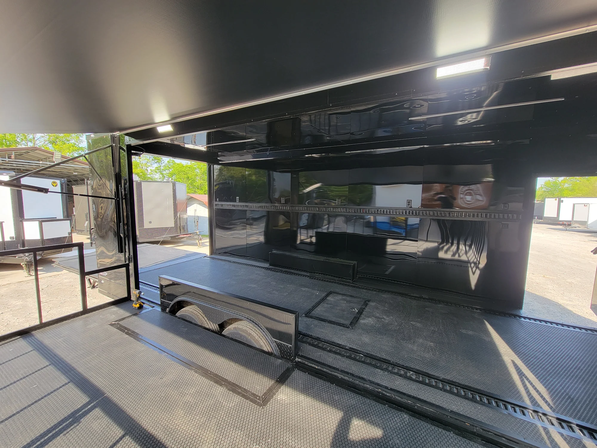 645-8.5-x-24-black-with-blackout-stage-trailer-with-awning-semi-screwless-exterior-17.webp 8.5' X 24' Black With Blackout Stage Trailer With Awning Semi Screwless Exterior