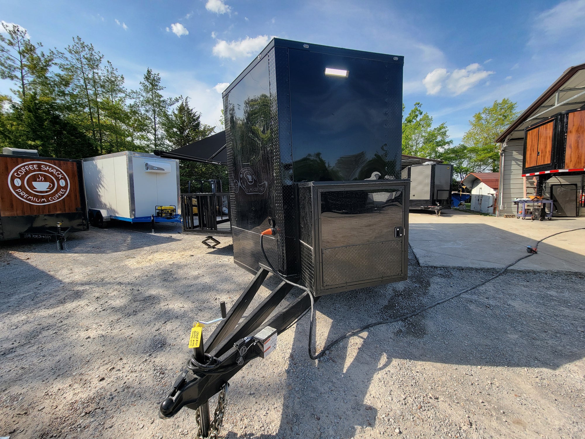 645-8.5-x-24-black-with-blackout-stage-trailer-with-awning-semi-screwless-exterior-2.jpg 8.5' X 24' Black With Blackout Stage Trailer With Awning Semi Screwless Exterior
