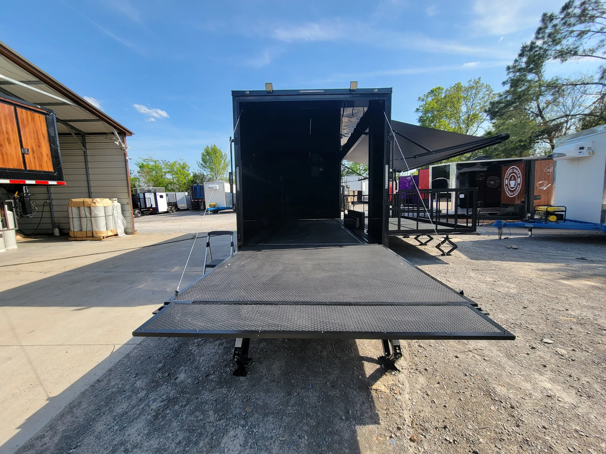 645-8.5-x-24-black-with-blackout-stage-trailer-with-awning-semi-screwless-exterior-7.webp 8.5' X 24' Black With Blackout Stage Trailer With Awning Semi Screwless Exterior