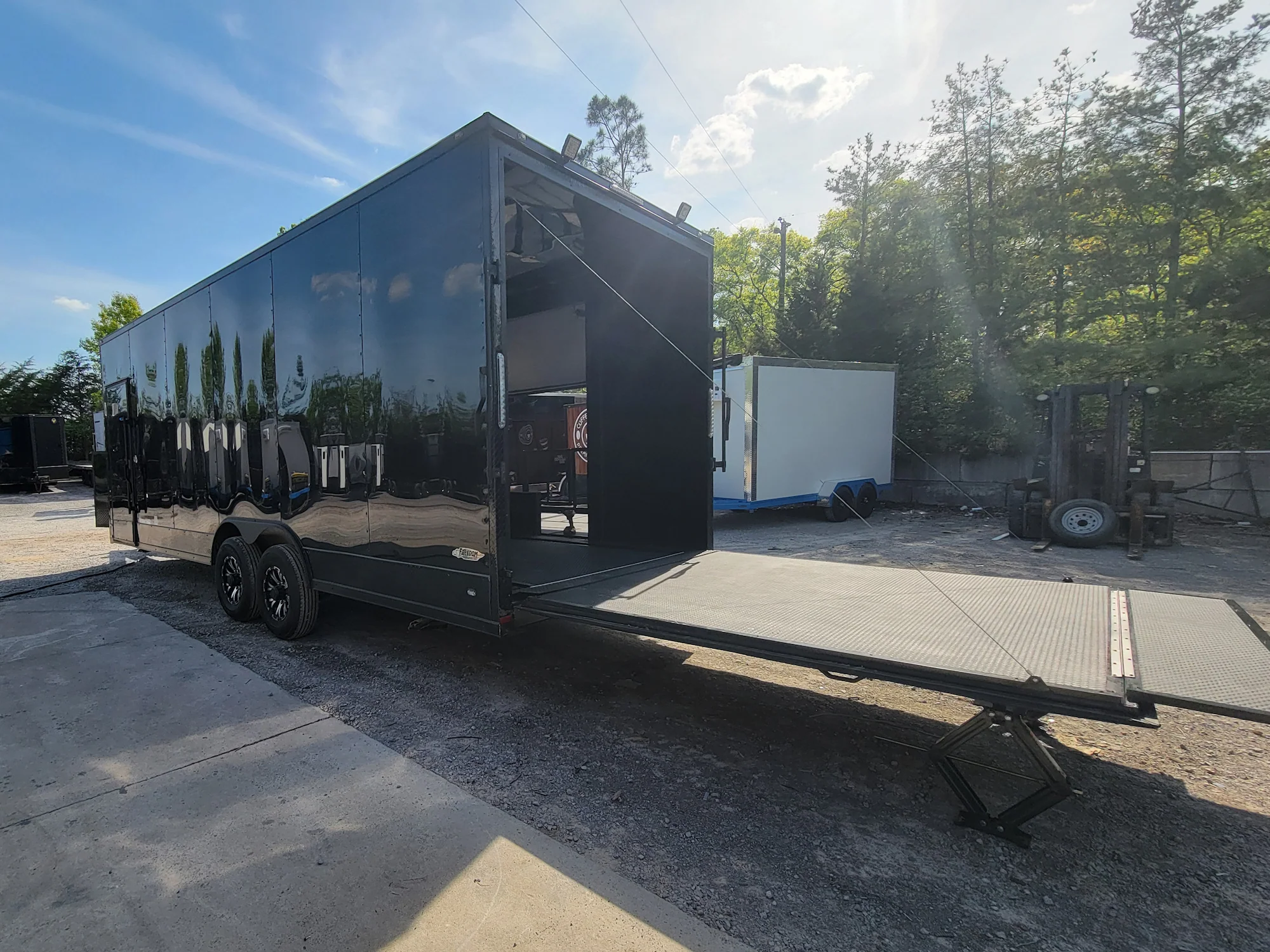 645-8.5-x-24-black-with-blackout-stage-trailer-with-awning-semi-screwless-exterior-8.webp 8.5' X 24' Black With Blackout Stage Trailer With Awning Semi Screwless Exterior