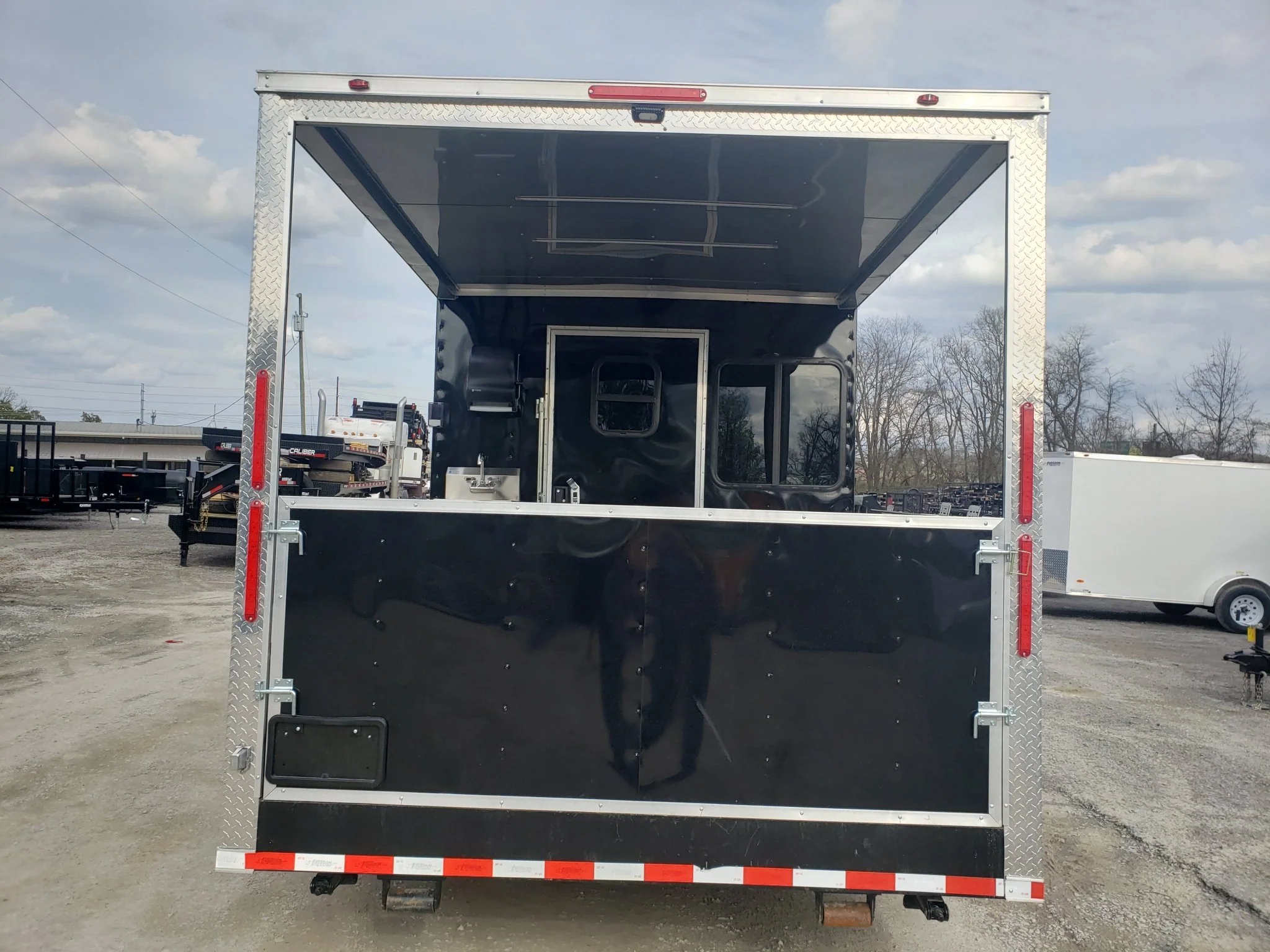 841-8.5-x-28-black-porch-style-bbq-vending-concession-trailer-4.webp 8.5' x 28' Black Porch Style BBQ Vending Concession Trailer