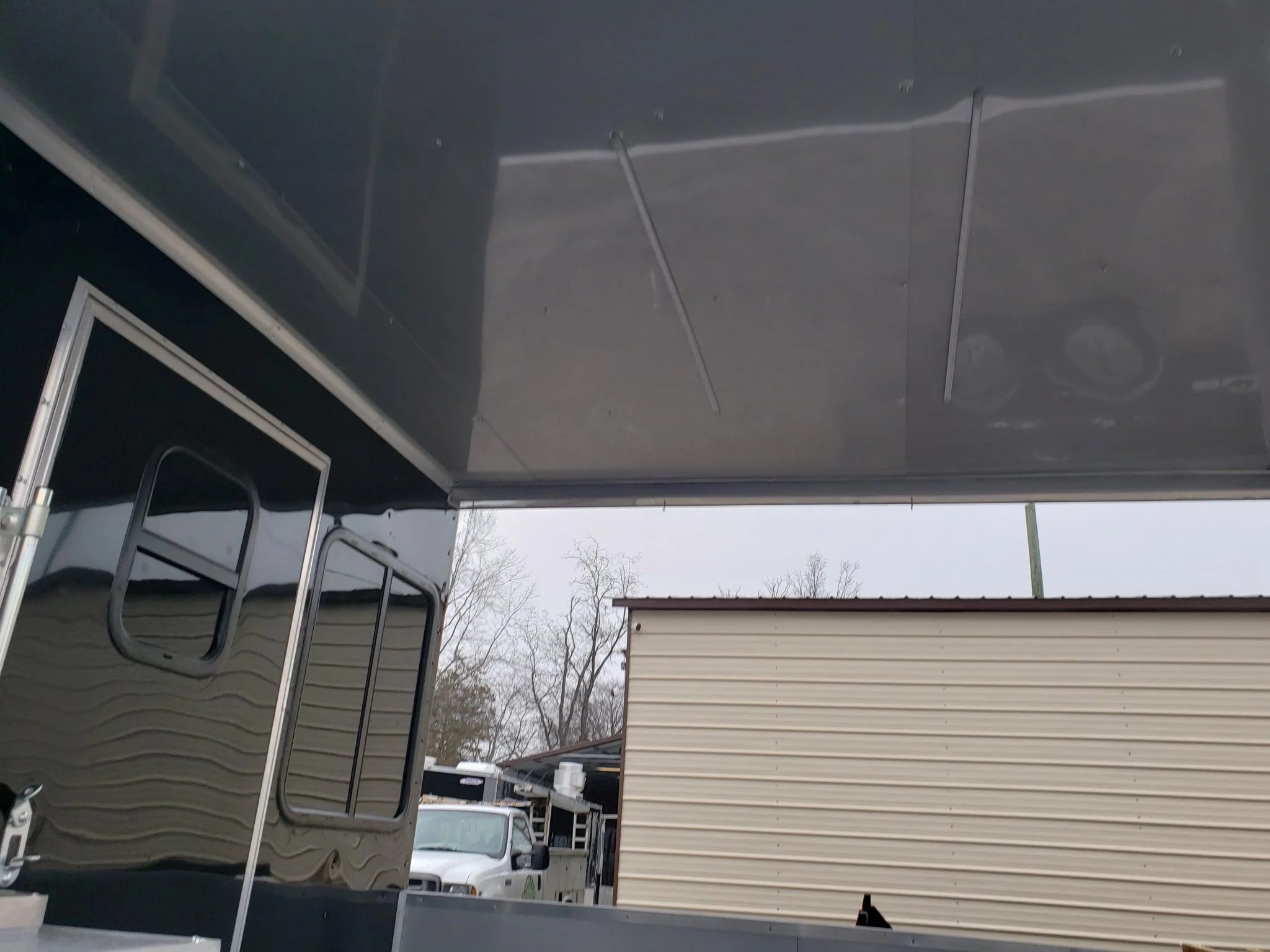 8.5' x 28' Black Porch Style BBQ Vending Concession Trailer