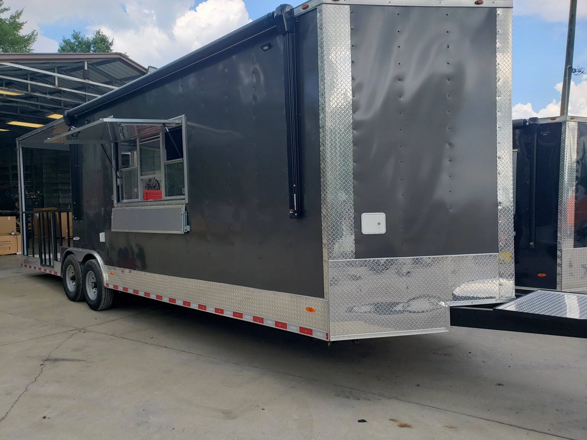 846-8.5-x-28-charcoal-gray-porch-style-concession-trailer-with-restroom-1.webp 8.5' x 28' Charcoal Gray Porch Style Concession Trailer with Restroom