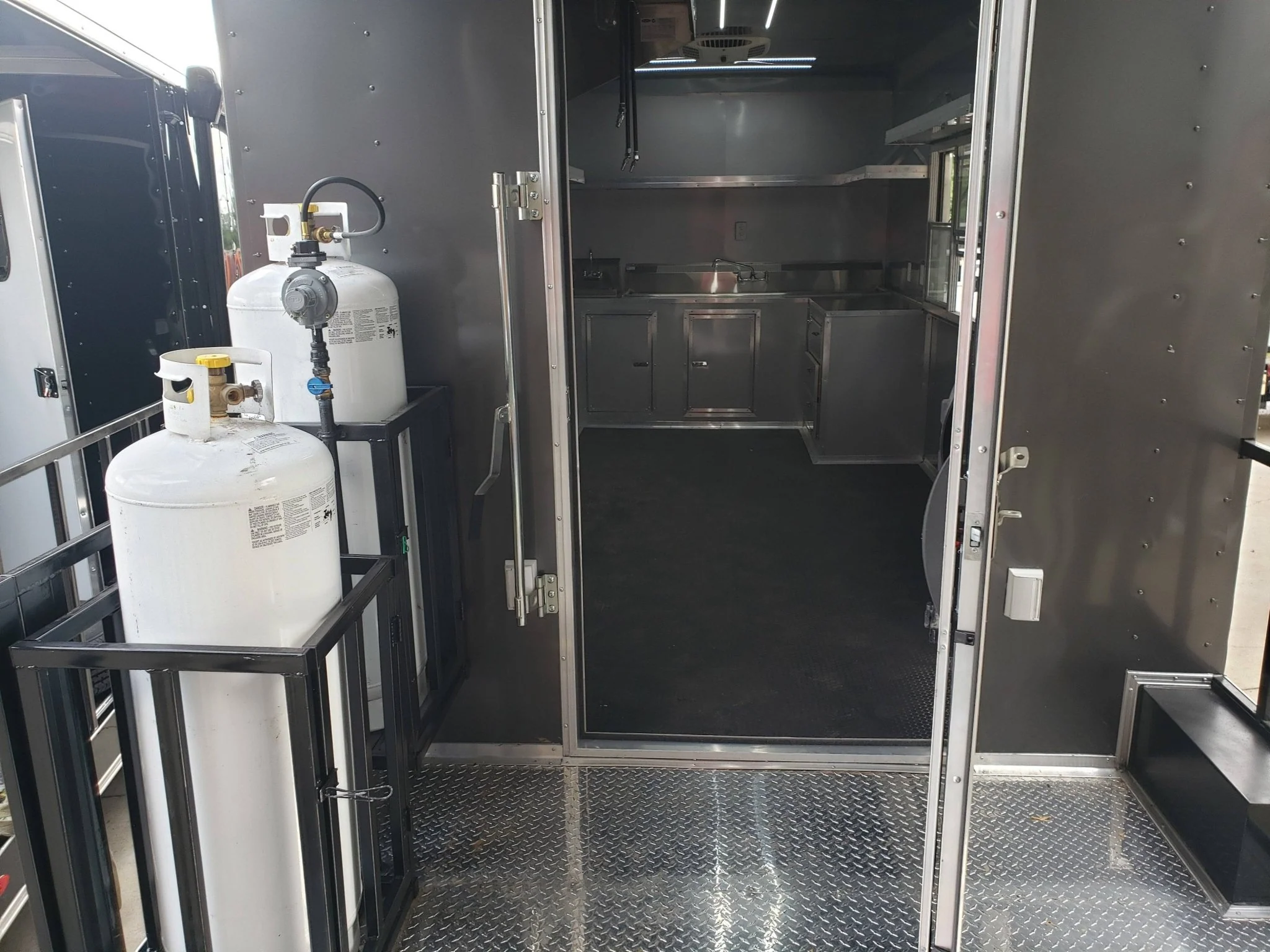 846-8.5-x-28-charcoal-gray-porch-style-concession-trailer-with-restroom-2.webp 8.5' x 28' Charcoal Gray Porch Style Concession Trailer with Restroom