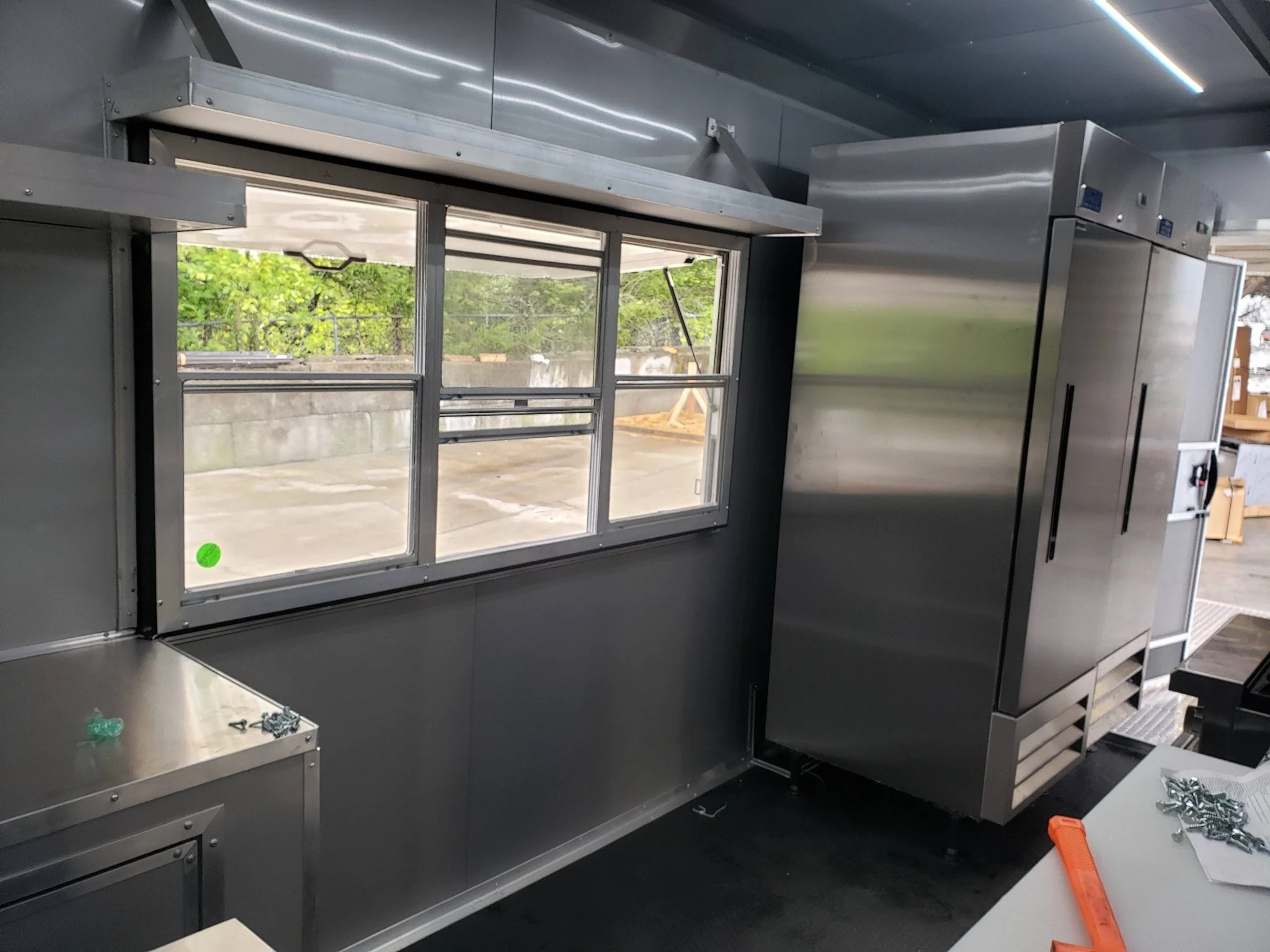 846-8.5-x-28-charcoal-gray-porch-style-concession-trailer-with-restroom-21.webp 8.5' x 28' Charcoal Gray Porch Style Concession Trailer with Restroom