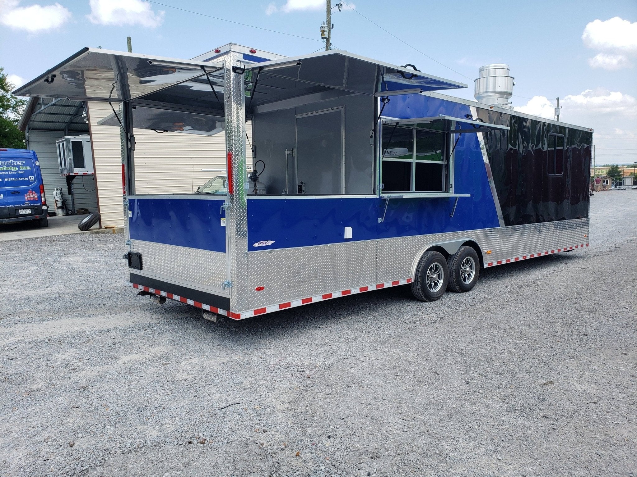873-8.5-x-30-black-and-cobalt-blue-bbq-porch-style-concession-trailer-1.jpg 8.5' x 30' Black and Cobalt Blue BBQ Porch Style Concession Trailer